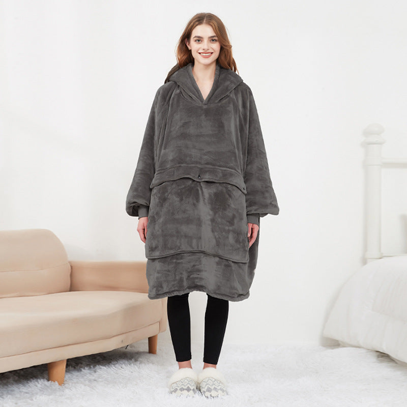 Woman wearing the grey Hoodgrove heated hoodie blanket, front view