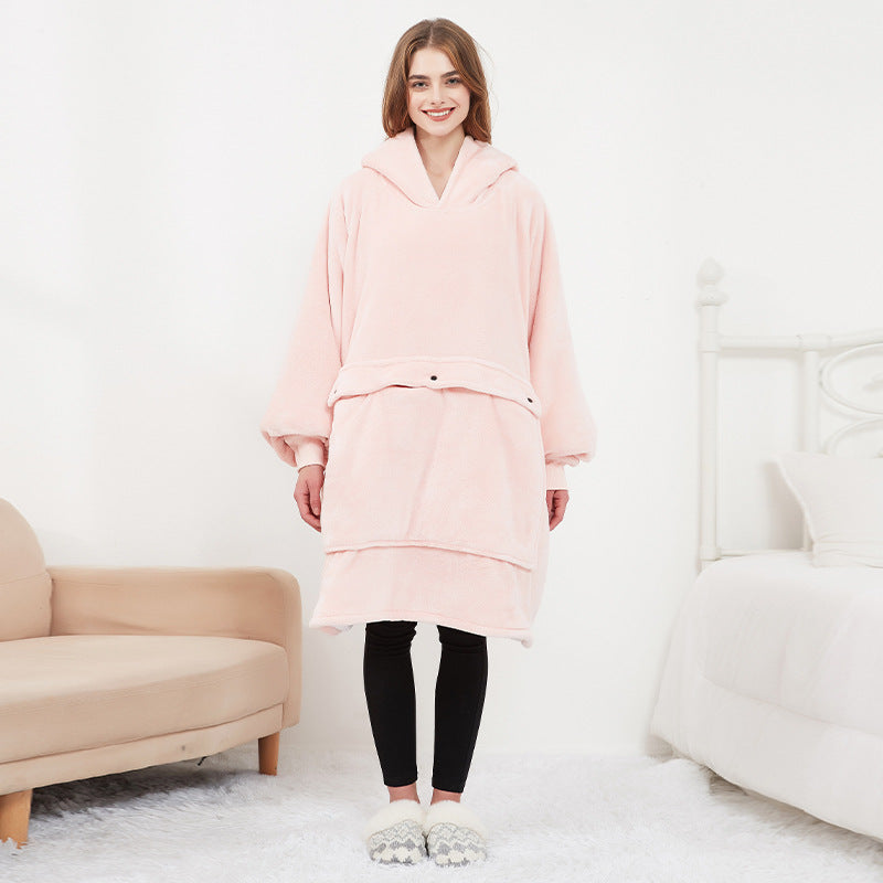 Woman wearing the pink Hoodgrove heated hoodie blanket, front view