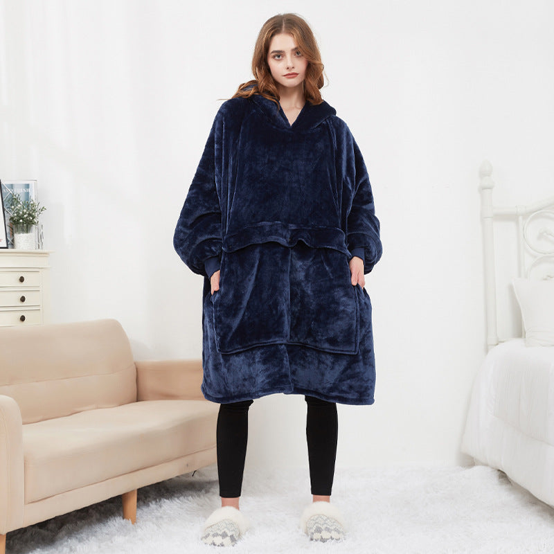 Woman wearing the navy Hoodgrove heated hoodie blanket, front view